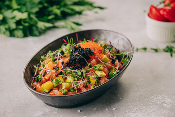 salad with salmon and red and black caviar