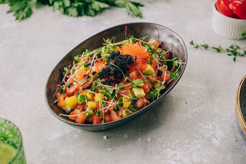 salad with salmon and red and black caviar