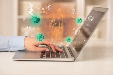 Doctor working on laptop with healthcare concept