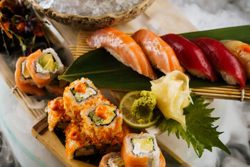 large set of sushi with good serving on ice