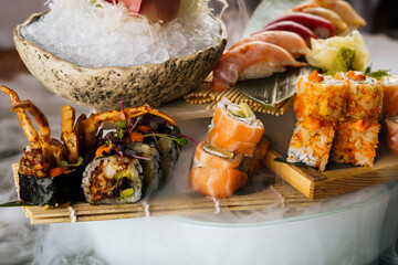 large set of sushi with good serving on ice