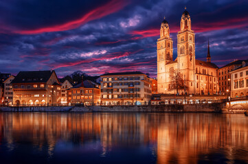 Fototapeta na wymiar The church Grossmunster. Zurich. Switzerland. Cityscape image of Zurich with colorful sky, during dramatic sunset. Popular travel destination