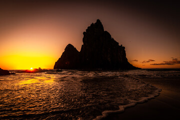 Sunset at Dois Irmãos Rock, Cacimba do Padre beach, Fernando de Noronha Archipelago, Brazil