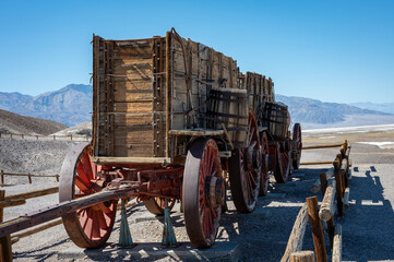 Detail of an old wooden cart abandoning in the desert of Death Valley
