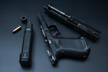 Repair and cleaning of weapons, disassembled gun close-up.