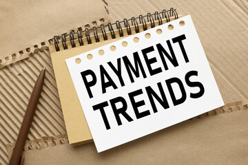 payment trends. two notepads on craft background