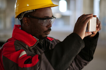 Worker taking photo on smartphone