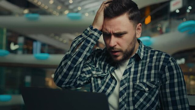 Disappointed depressed sad businessman freelancer caucasian man has problem with computer make mistake error send incorrect data read bad e-mail message upset male fail business deal bankruptcy defeat