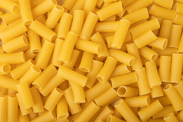 Uncooked pasta close up background.