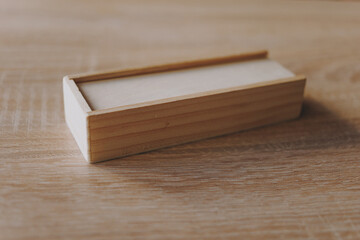 Dominoes in a wooden box, a game for two