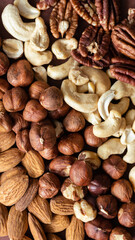 Almonds, hazelnuts, cashew and pecans nuts top view.