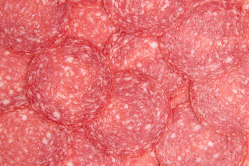 background of salami sausage slices close up