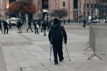 Man walks on crutches