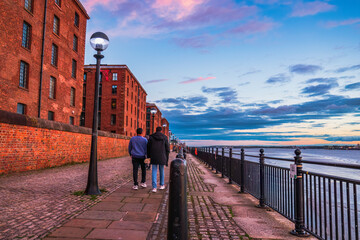 people waling on Walkway between the Royal Albert Dock and the Waterfront in Liverpool, United Kingdom	
 - Powered by Adobe