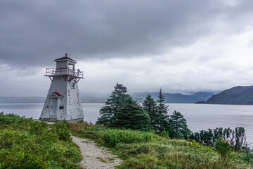 Fototapeta na wymiar Woody Point, Newfoundland, Canada: Woody Point lighthouse, on Bonne Bay in the Gros Morne National Park, designated a Heritage Lighthouse by the Canadian government.