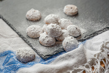 Fototapeta na wymiar Greek Christmas cookies Kourabides with powdered sugar