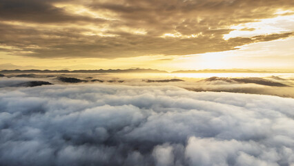 Fototapeta na wymiar Aerial view of landscape Sunrise above clouds dramatic light