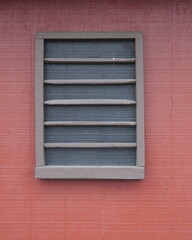 Taupe Painted Vent on Red Painted Wood Paneling