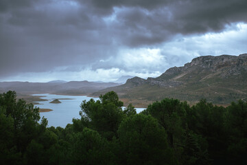 lake with mountains in a storm