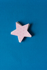 pile of paper stars isolated on blue paper