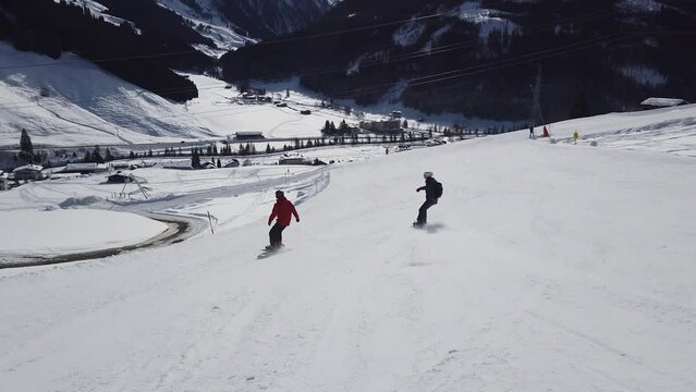 Girl Snowboarder. Perfect snowboarding skills. Girl snowboarding at Mayrhofen in Austrian apls.