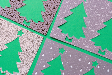 four stencils with stylized paper holiday tree cutouts