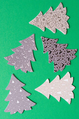 paper tree shapes on green paper
