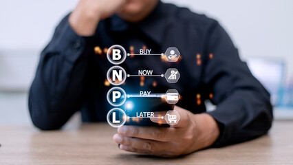 Businessmen holding a smartphone with icons of BNPL with online shopping icons technology. BNPL Buy...
