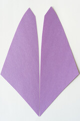 two book-matched purple shapes on blank paper