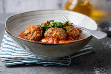 Meatballs with vegetables and tomato sauce