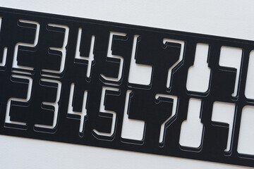 stencils with digital number shapes on blank paper