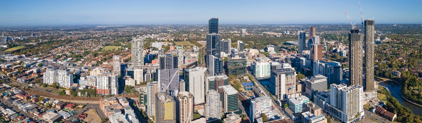 Fototapeta premium Panoramic aerial drone view of Parramatta CBD in Greater Western Sydney, NSW, Australia showing development of the city as at December 2022