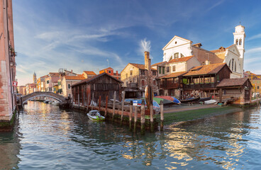 Fototapeta na wymiar Venice. An old gondola repair shop on the bank of the canal.