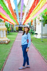 Asian female tourist while touring the Lanna style festival in Lamphun province