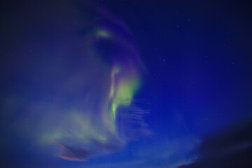 Naklejka na ściany i meble Aurora borealis in the sky astronomy night stars north shining