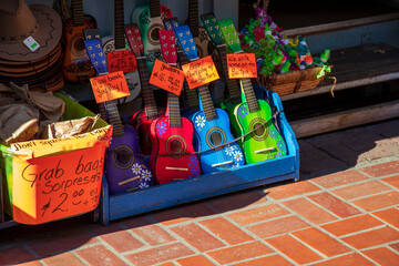 tiny colorful toy guitars in a bin for sale at Olvera Street in Los Angeles California USA