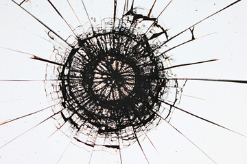 cracks on the glass impact on the glass, abstract background broken window damage