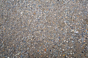 Gray small rocks ground texture.