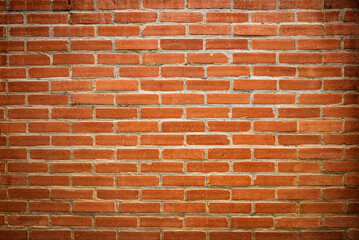 Obraz premium abstract background of a neatly arranged orange brick wall.