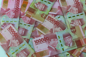 Indonesian Rupiah, Indonesian currency one hundred thousand rupiah on white marble background.