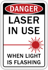 Laser danger warning sign and label laser in use when light is flashing