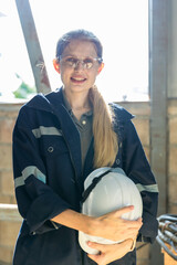 Woman worker working in warehouse. Woman worker  standing in Industrial warehouse , industrial workers concept