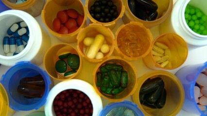 Concept of world pharmaceutical medical research, trials and developing coronavirus drugs or vaccines. Hydroxychloroquine or chloroquine covid-19 bottles pills in medical lab macro view.