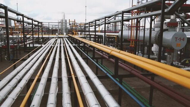 Gas pipelines connected by flanges for gas distribution at a modern compressor station. Fuel transportation plant