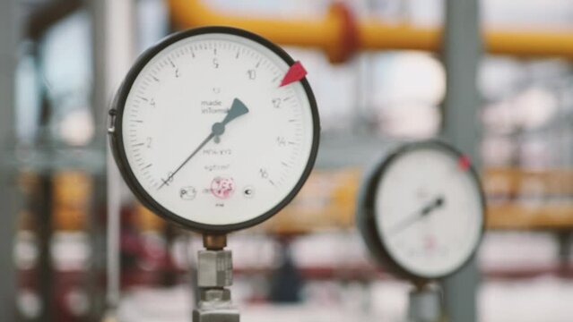 Gas and oil pipeline with distribution pipes. Pressure gauge shows the pressure in the system