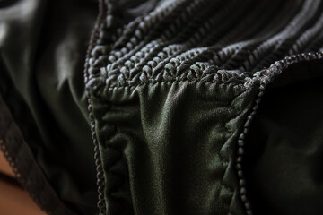 Close up shot of the green crochet patterns luxury elegant women brief panty.