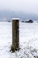 post in the snowy field