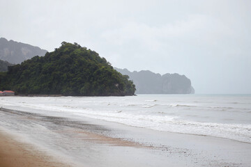 Sea wave on the beach in rainy day
