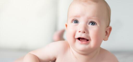 Little baby boy with blue eyes and blond hairs