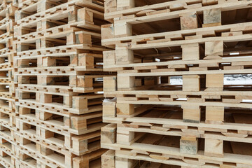New wooden paletes stacked to be used in a warehouse and transportation.
